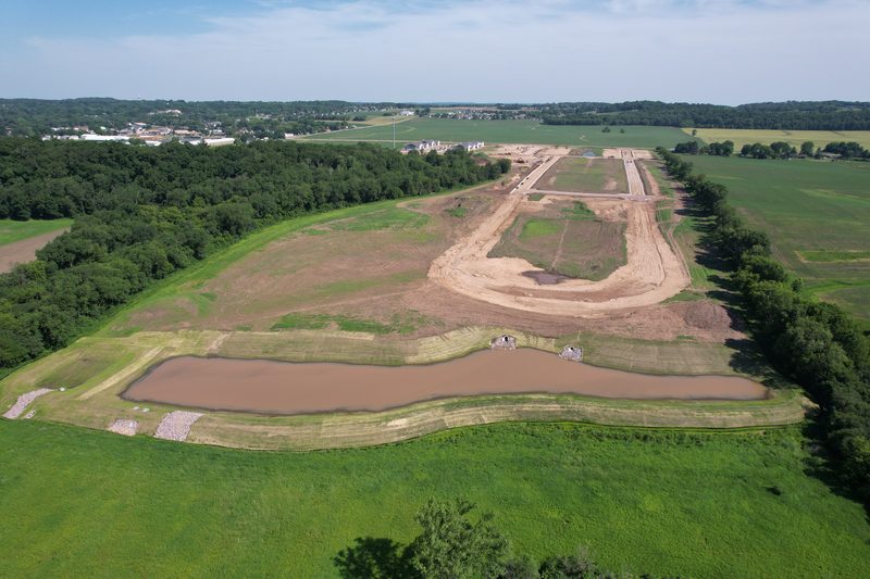 Greenfield Reserve from the air, with graded lots and the retention pond